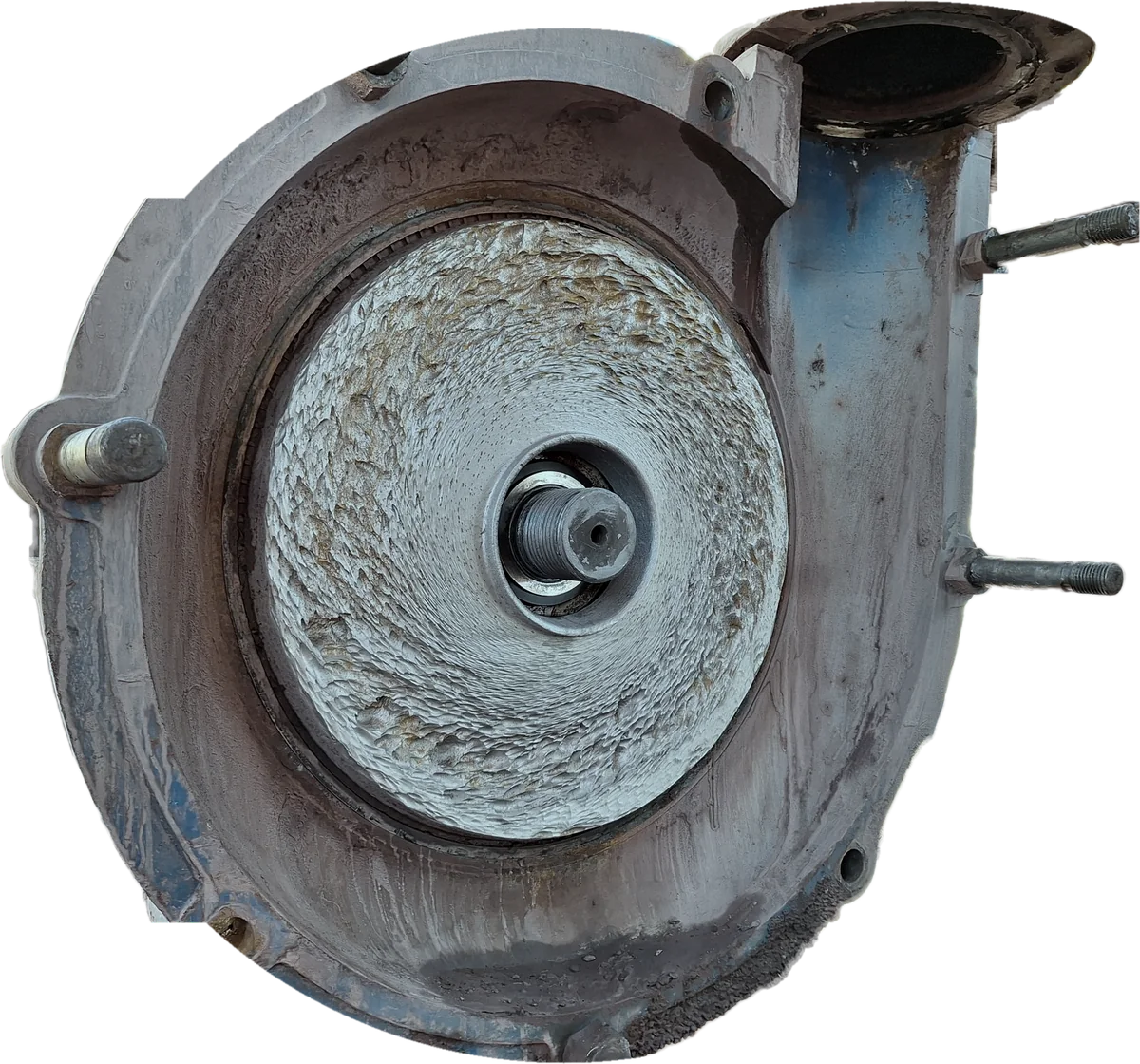 A slurry pump opened up at inspection, with the impeller out and the worn liner showing around the shaft